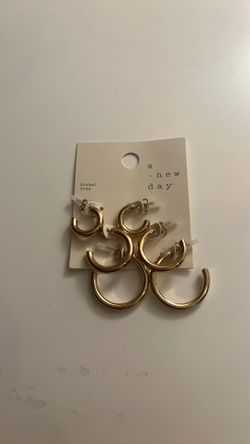 3 pairs of gold hoop earrings