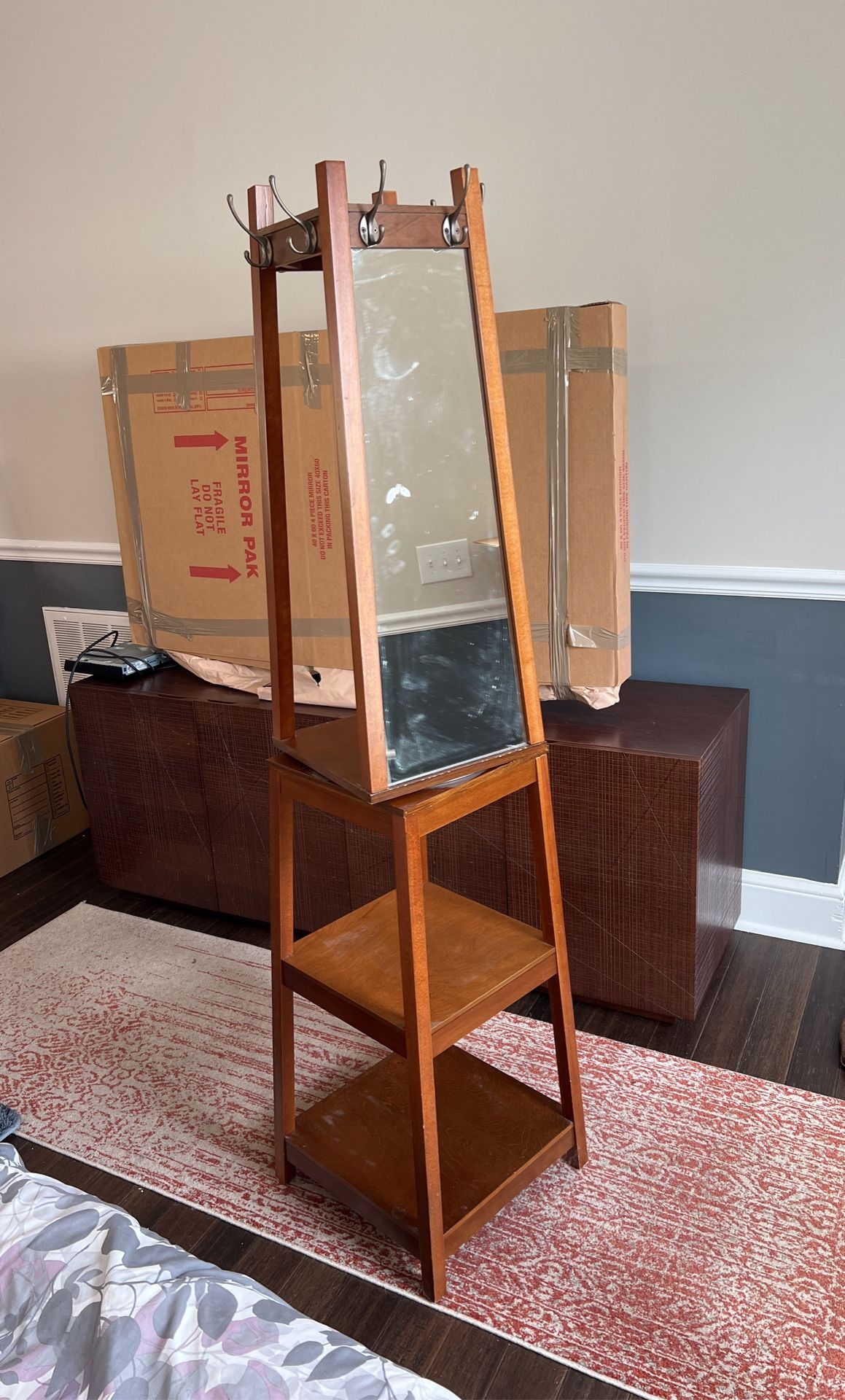 Swivel mirror tower with shelves
