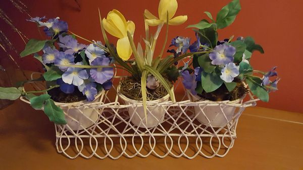 Distressed planter holder...Plant holder with silk flowers removable pots..16 w 12 t 5d ... this item was used for home staging purposes...