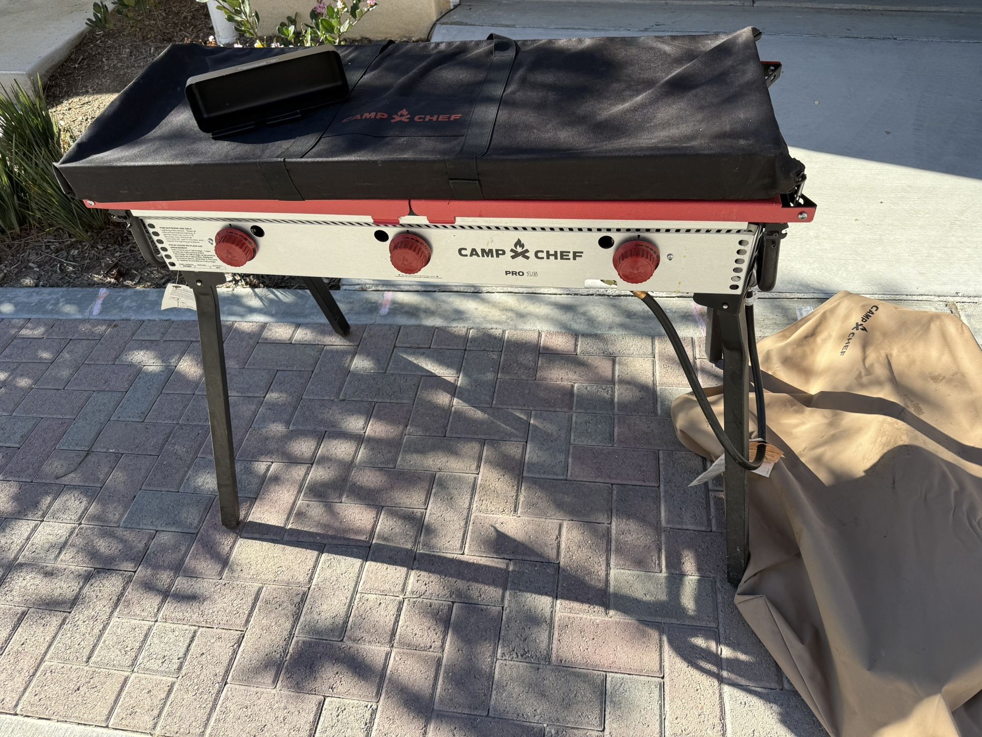 Camp Chef Pro 15 with cover and 3 burner griddle with cover