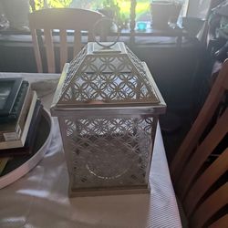 silver metal and glass candle lantern
