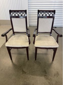 Pair Of Elegant Dark Wood Dining Room Chairs  22 1/4” wide  19 1/2” deep  19 1/2” floor to seat  41” tall in the back
