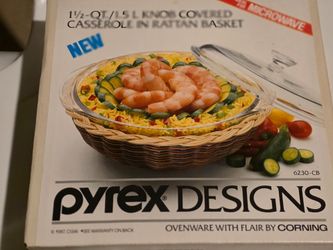 Pyrex bowl with lid by Corning.