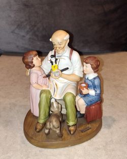 VINTAGE 1980 NORMAN ROCKWELL CLUB ANNUAL FIGURINE "THE TOY MAKER" HAND PAINTED PORCELAIN FIGURINE/ STATUE INSPIRED BY THE FAMOUS 1920 NORMAN ROCKWELL 