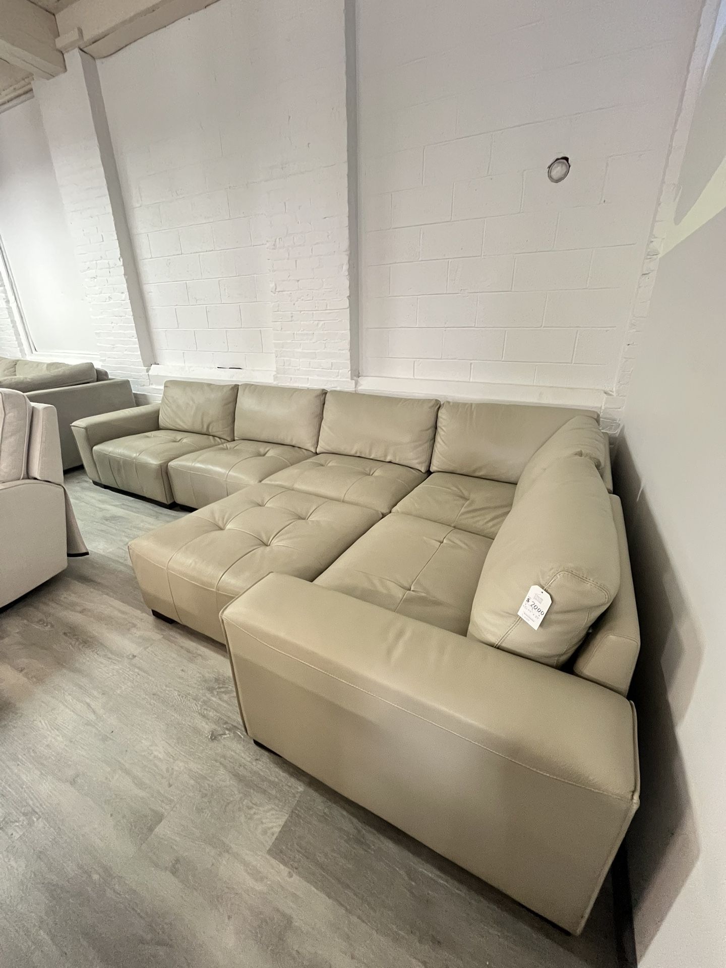 Teagan Leather Modular Sectional With Ottoman! Delivery And Financing Available!