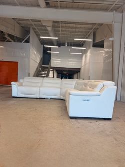 Leather electric reclining sectional.