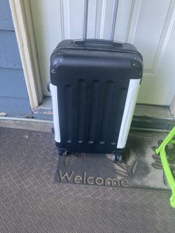 Was green tape now it’s white Tape hard side suitcase, not for checked bag Pdx
