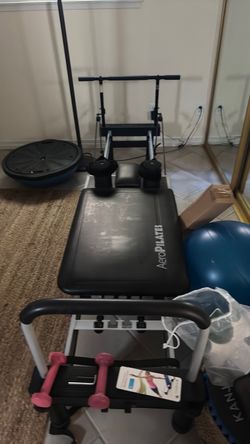 AeroPilates Reformer Machine with pull up bar addition