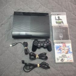 Sony Playstation 3 super slim with controller cords and 3 games