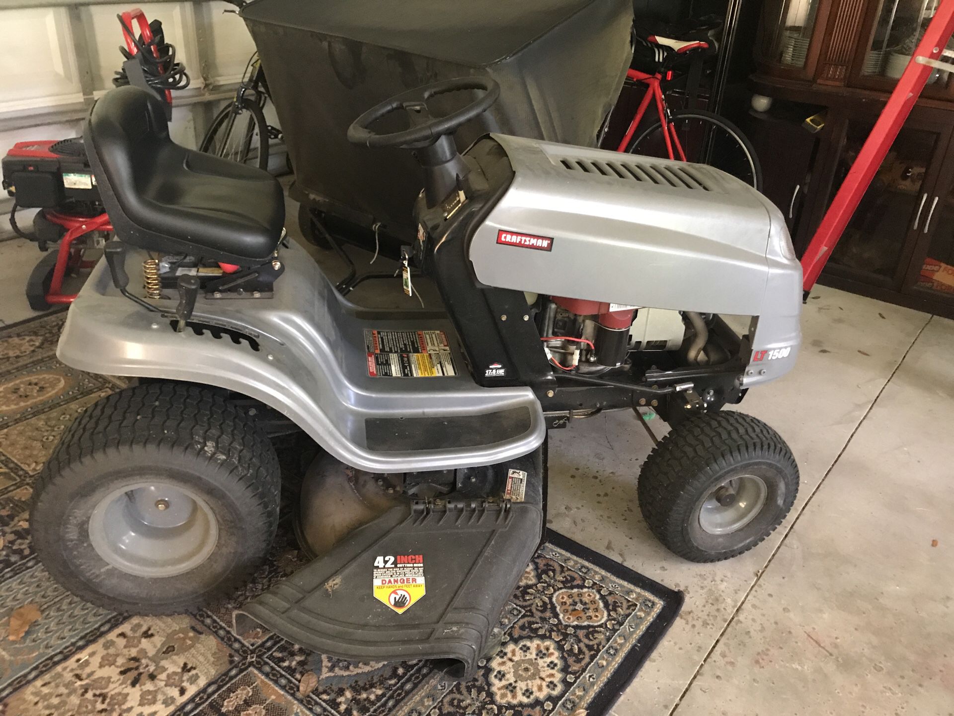 Lawn tractor with leaf sweeper