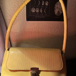 Yellow cute handbag with a crocodile texture