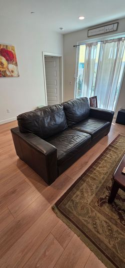 Lether sofa 7ft long × 3ft wide