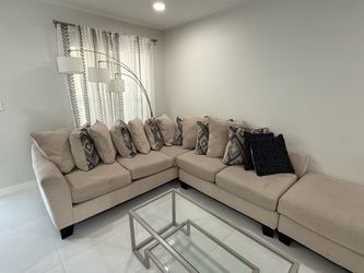 Living room set with center and side table.