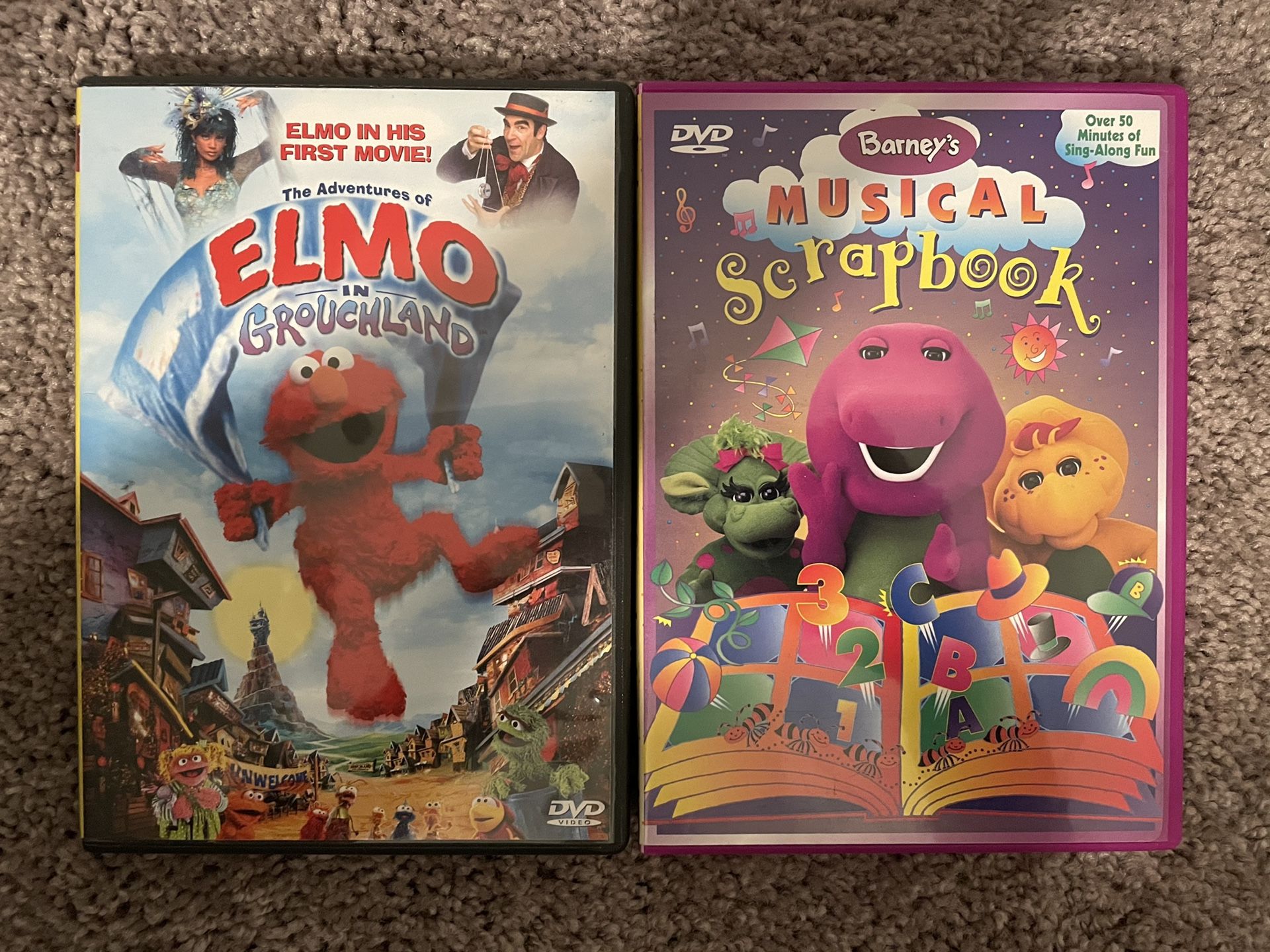 The Adventures Of Elmo In Grouchland and Barney’s Musical Scrapbook dvds