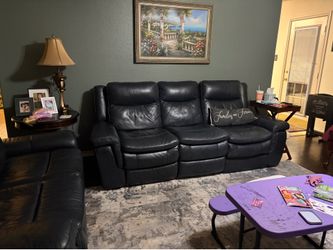 Blue leather recliner couch and loveseat