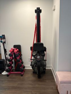 Rowing and strength training machine