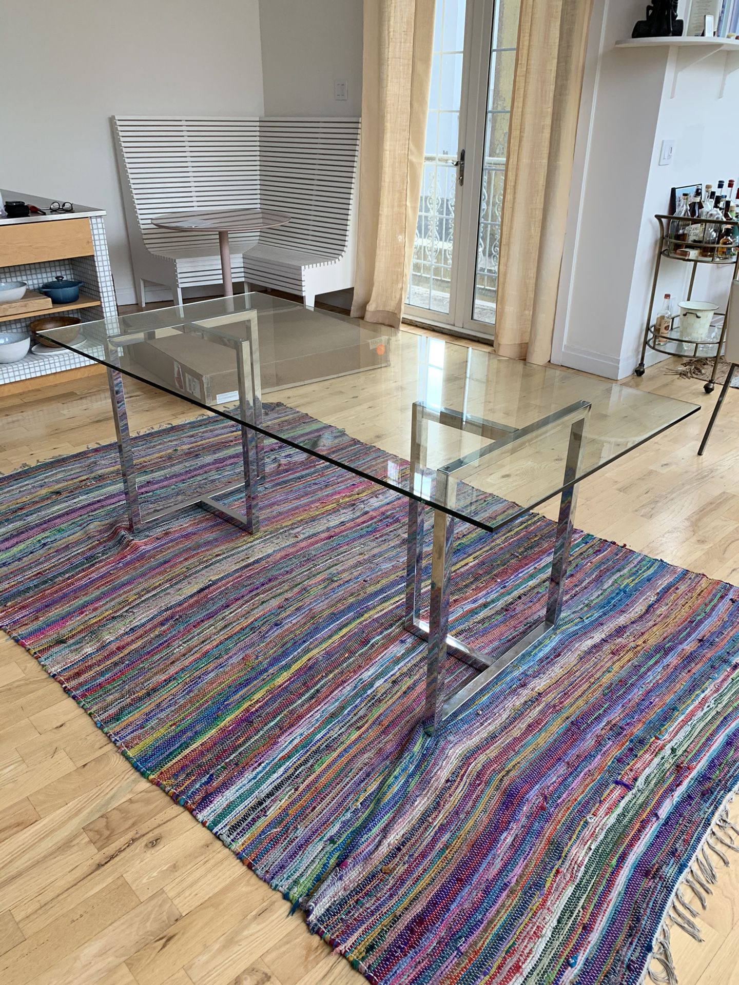 CB2 glass and Chrome Silverado Dining Table