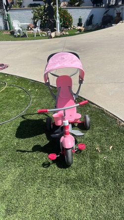 Pink Radio Flyer tricycle