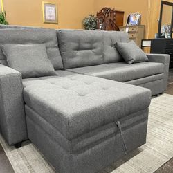 Gray Reversible Sectional with Pull Out Bed Ottoman