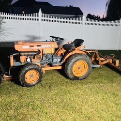 Kubota B7100 Tractor 1978 4WD with plow and rake MUST SELL