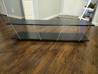Black and gold tv stand