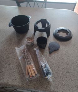 Brand new cast iron fondue set