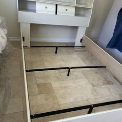 bed frame with a bookshelf 