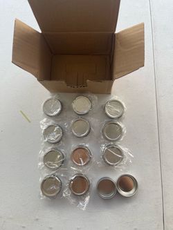 11 Aluminum small tins with screw lids.