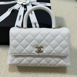Chanel Coco Handle Flap Bag in white caviar leather with gold hardware