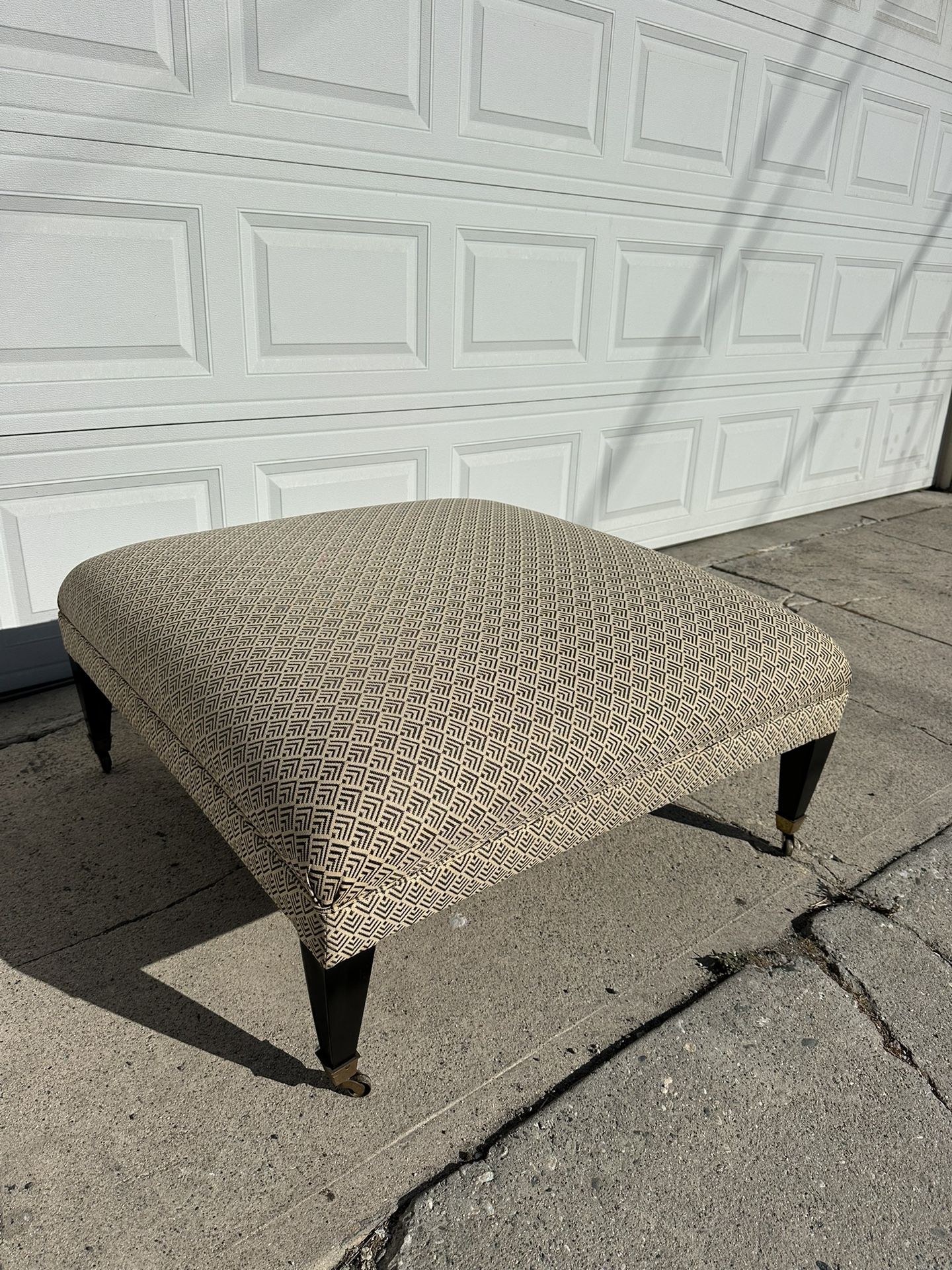 Upholstered Ottoman With Casters