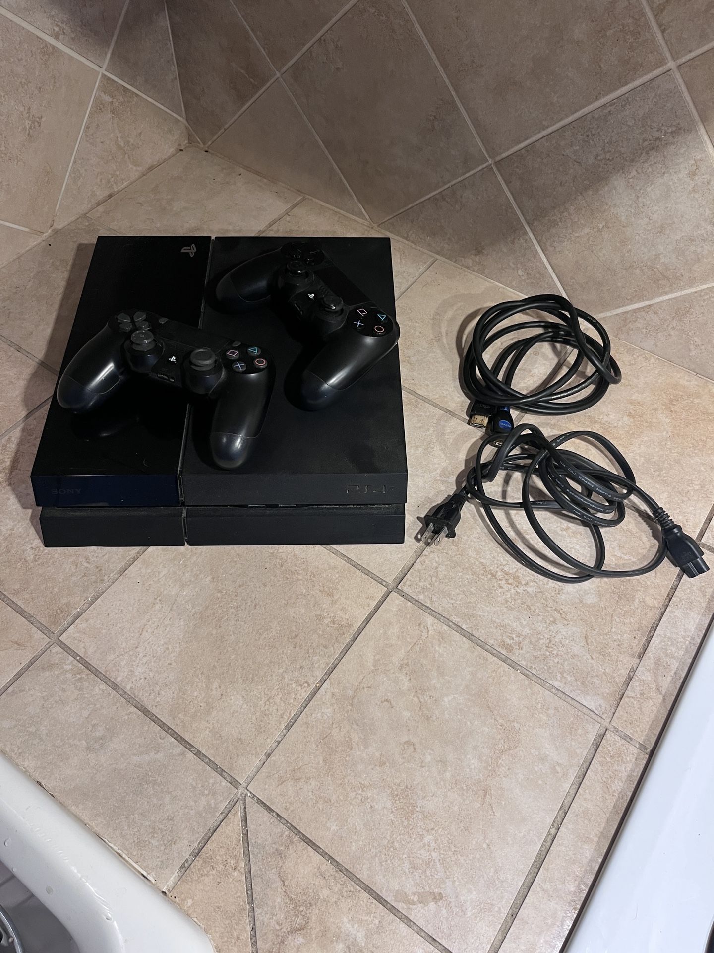 PS4 with two Dual Shock controllers