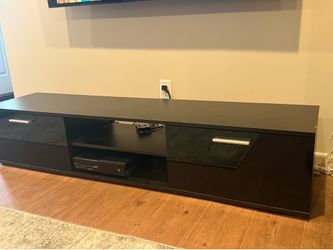 2 piece entertainment center. Purchased 1 year ago.
