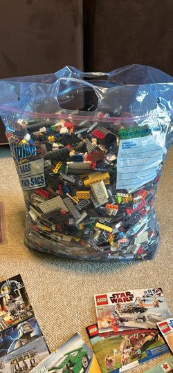 34 lb bag of legos with manuals