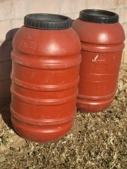 50+ gallons -- Heavy plastic storage barrels