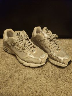 Gray/silver Adidas tennis shoes