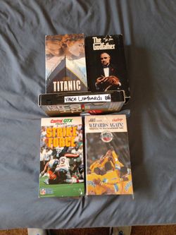 VHS'S VINCE LOMBARDI 88', THE GODFATHER SET, TITANIC, BEARS STRIKE FORCE AND 95' WIZARDS VHS