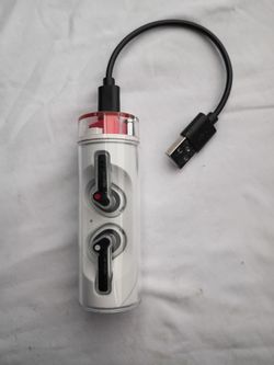 Nothing Ear (stick) wireless earbud set, featuring a unique, transparent, cylinder-shaped charging case.