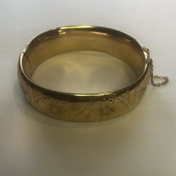 Beautiful Hayward  yellow gold wide hinged and floral etched bangle bracelet with safety chain