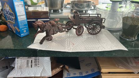 Antique cast iron horse drawn fire wagon