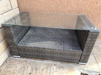 Outdoor wicker table with glass top for $55.
