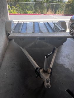 Trailer for transporting a motorcycle
