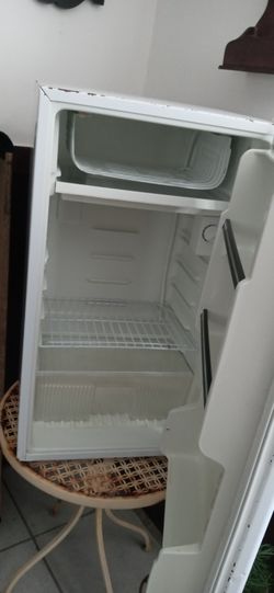 Mini fridge , microwave, and other kitchen items