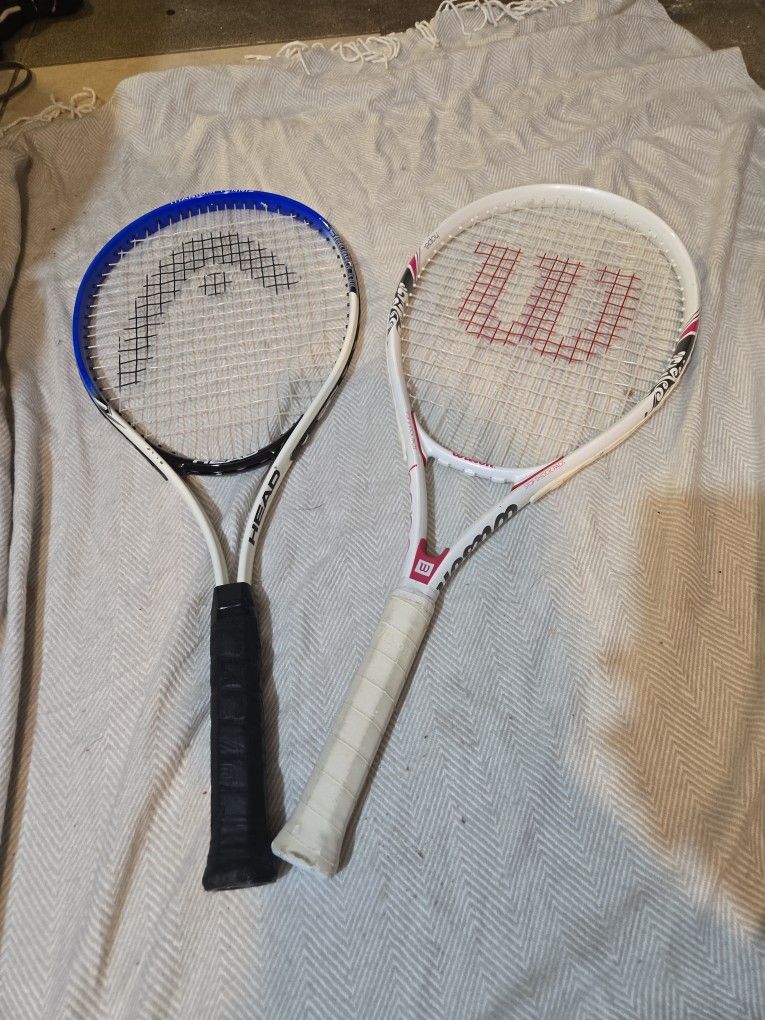 2 Tennis Rackets, And A Bag Of Tennis Balls