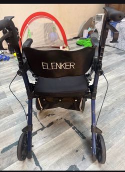 Elenker walker with seat, brakes and storage.