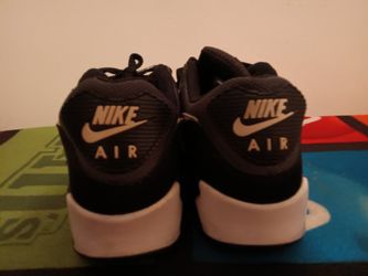 Nike Airs Black And Gray And White Used But In A Good Condition Size 10 And A Half