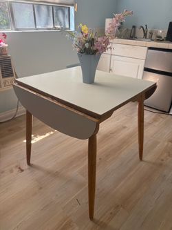 Small white table with fold down sides