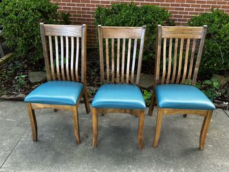 Three teal seated chairs