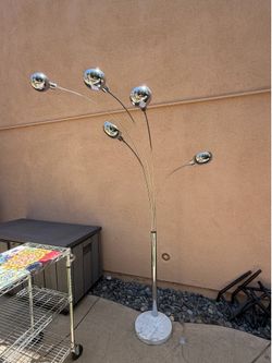 Floor lamp. Silver with white marble base.