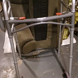 NEW WITH TAGS DRIVE BRAND DUAL RELEASE FOLDING WALKER W/ 5 INCH WHEELS, 2 BUTTONS, ADJUSTABLE HEIGHT