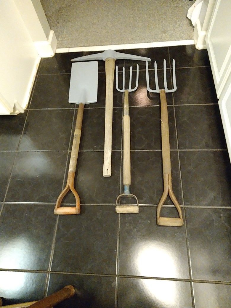 DIGGING TOOLS. 2 FORKS. 1 DOUBLE PICK. 1 SQ EDGE SHOVEL. 125.00 ALL 4 PEICES